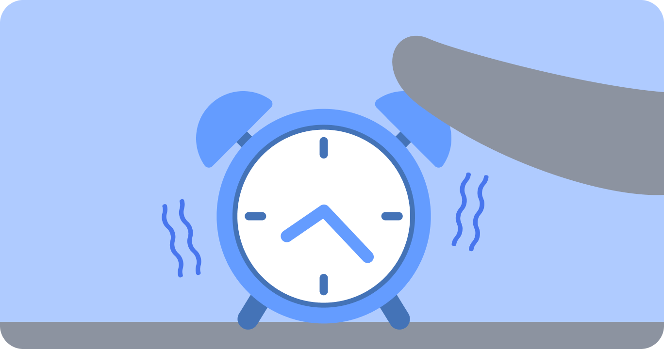 眠そうに目覚まし時計に手を伸ばす人